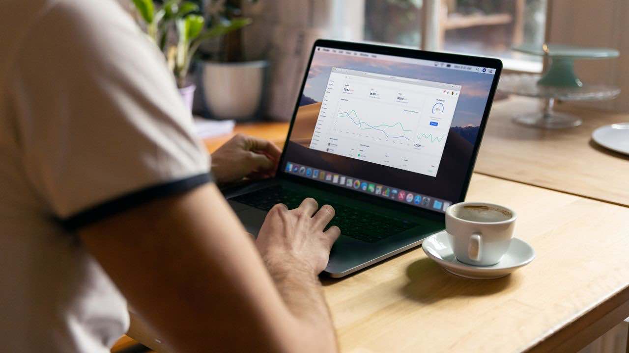SEO specialist reviewing a website analytics dashboard on a laptop